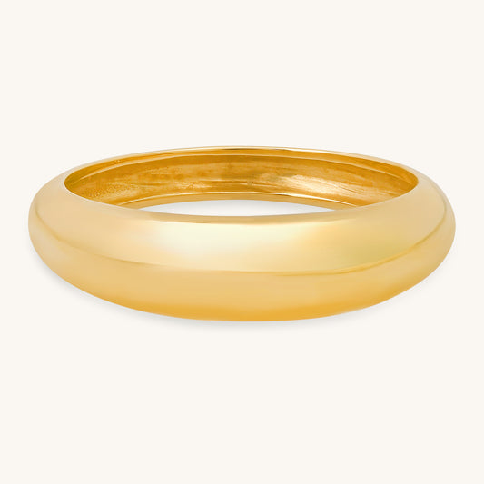 The "Duomo" ring is a stunning tribute to timeless simplicity and class, inspired by my sister-in-law Joelle's fashion studies in Florence. Just like the iconic Duomo cathedral that graces the skyline of Florence, this dome ring embodies her sense of enduring beauty and sophistication. This ring is made of 14-karat solid yellow gold. The average weight of this ring is 3 grams. The front band width of this ring is 5 millimeters. The back band width of this ring is 2