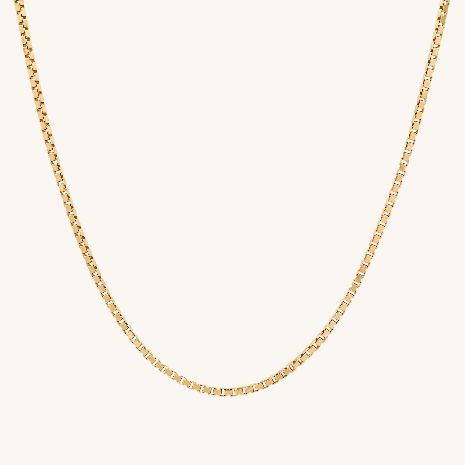 This box chain complements a Pendant beautifully and can also be worn on its own or layered with other jewelry pieces. This chain is solid 14 karat yellow gold. The width of the chain is 1.4 millimeters. The average weight of the 16-inch Chain is 4.6 grams. The average weight of the 20-inch chain is 5.7 grams. The average weight of the 22-inch chain is 6.2 grams. The average weight of the 24-inch chain is 6.5 grams. This chain has a lobster-style clasp.