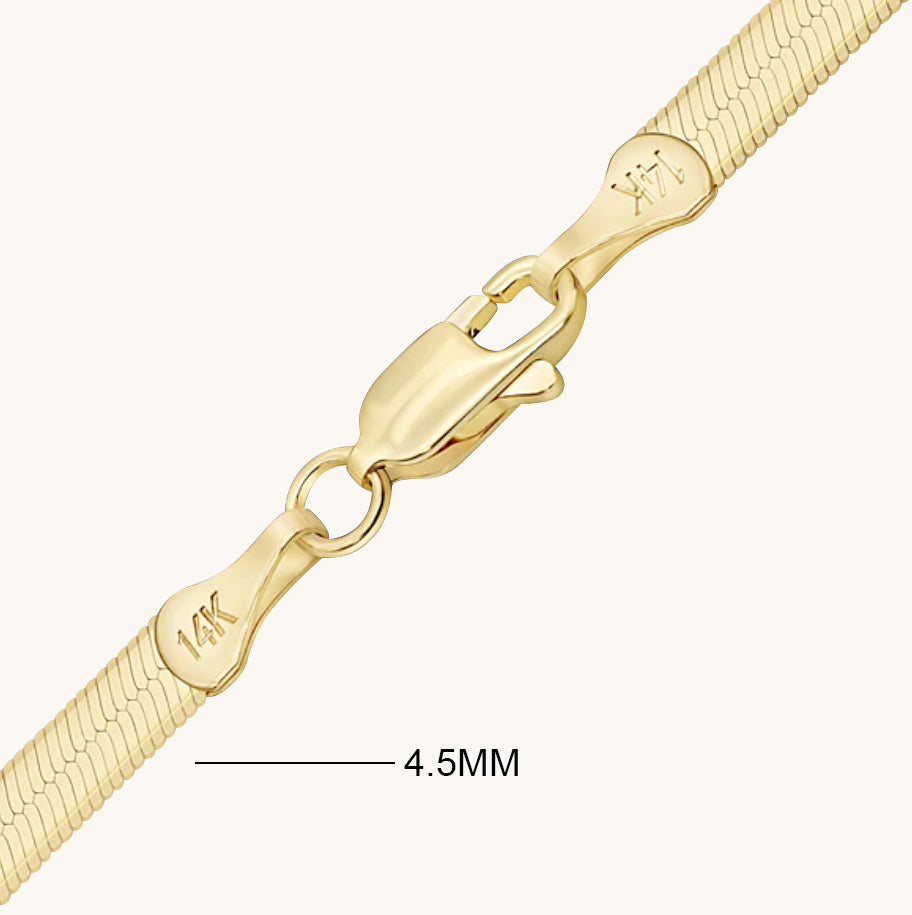 This specific photo shows the 4 millimeter chain labeled with the text "4 millimeters" for the purpose of comparing to the next photo which shows the 3 millimeter chain labeled with the text "3 millimeters."